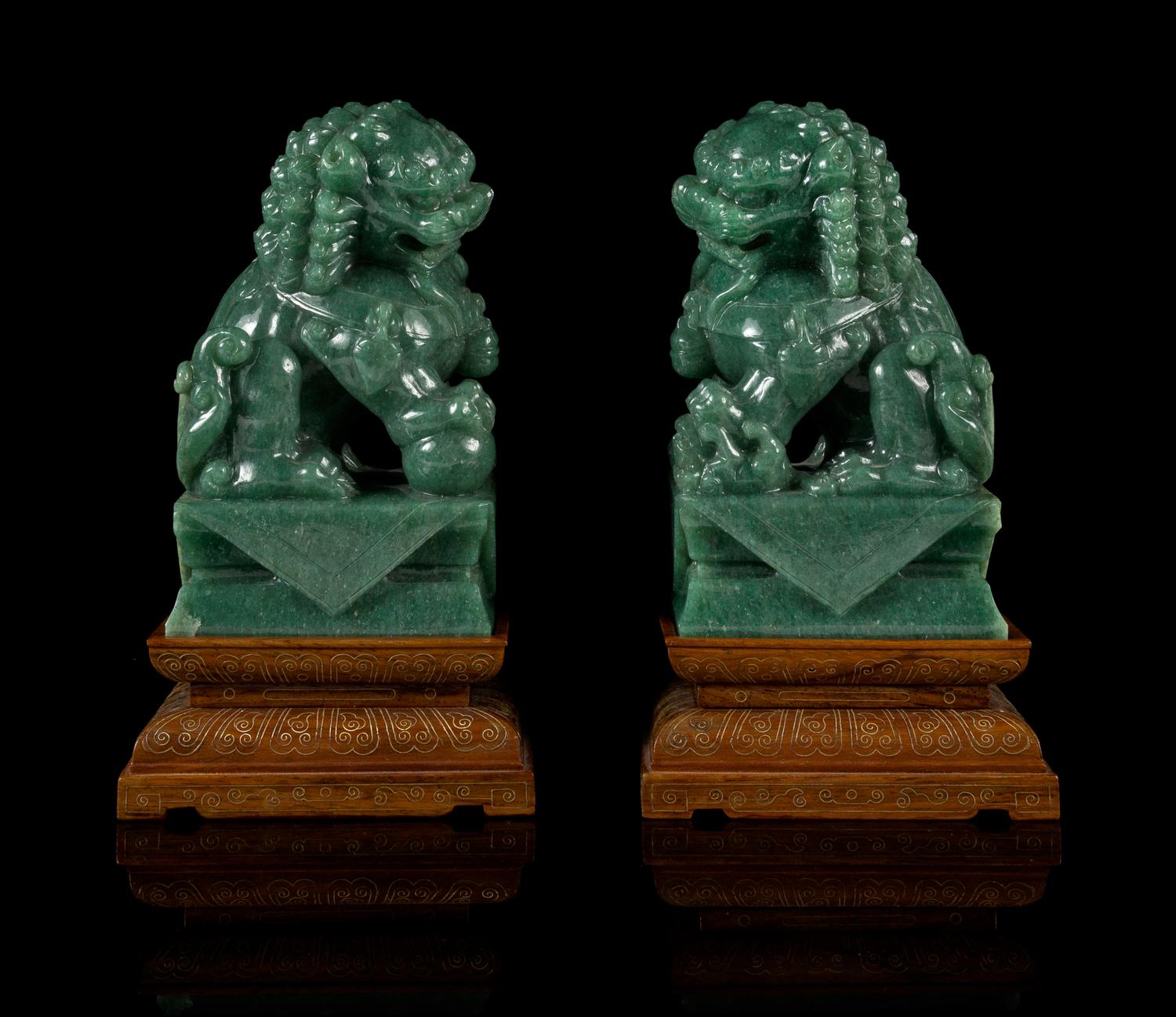 A Pair of Chinese Green Jade Figures of Fu Lions Height 6 1/4 inches. — 20TH CENTURY