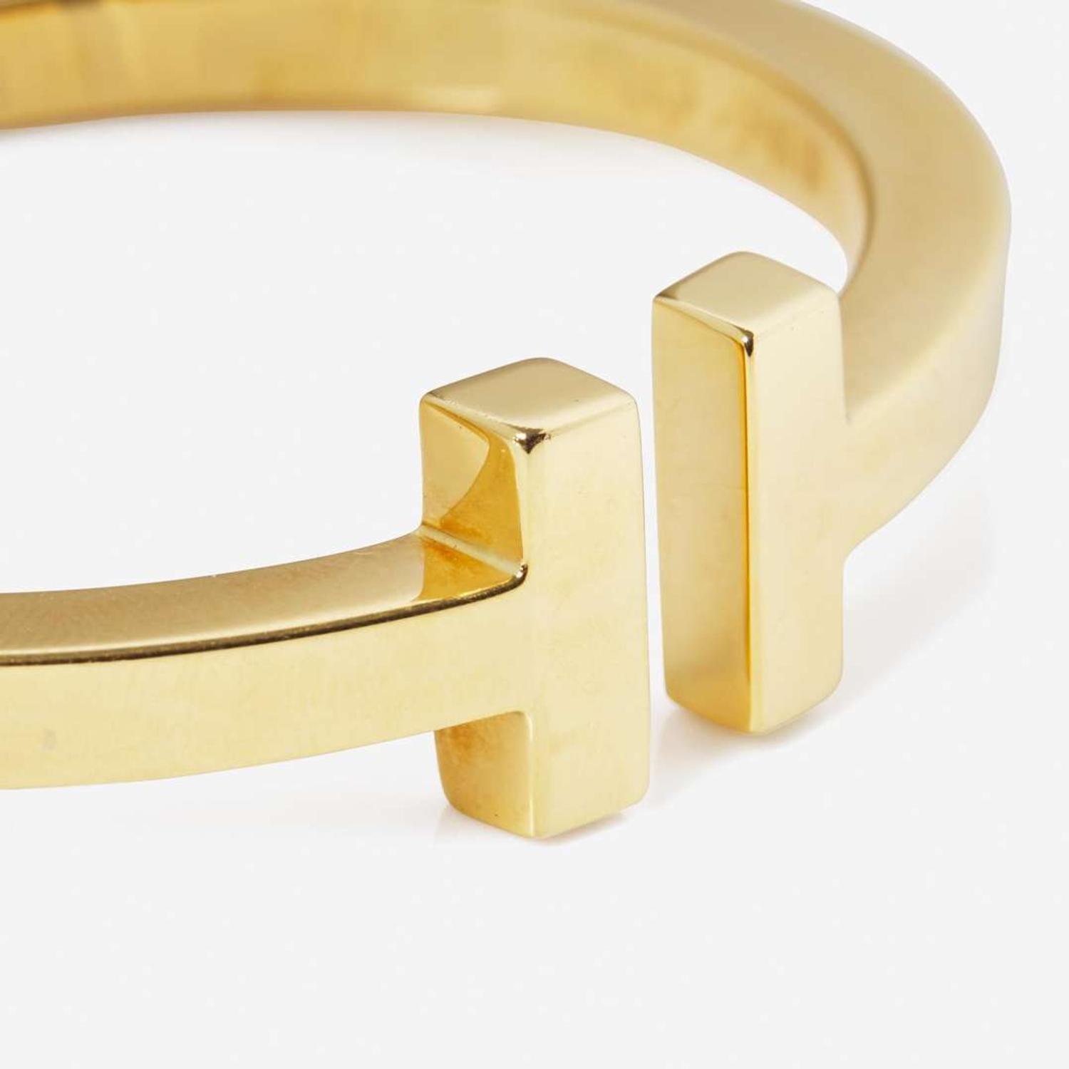 An 18K Yellow Gold " T" Bracelet by Tiffany & Co.