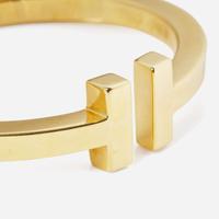 An 18K Yellow Gold " T" Bracelet by Tiffany & Co.