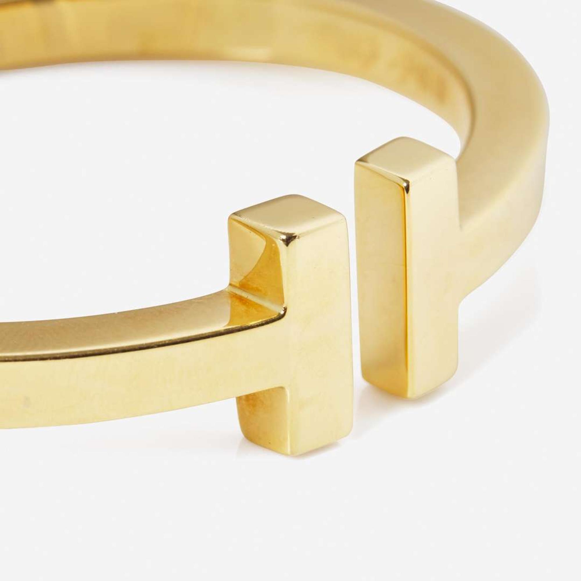 An 18K Yellow Gold " T" Bracelet by Tiffany & Co.