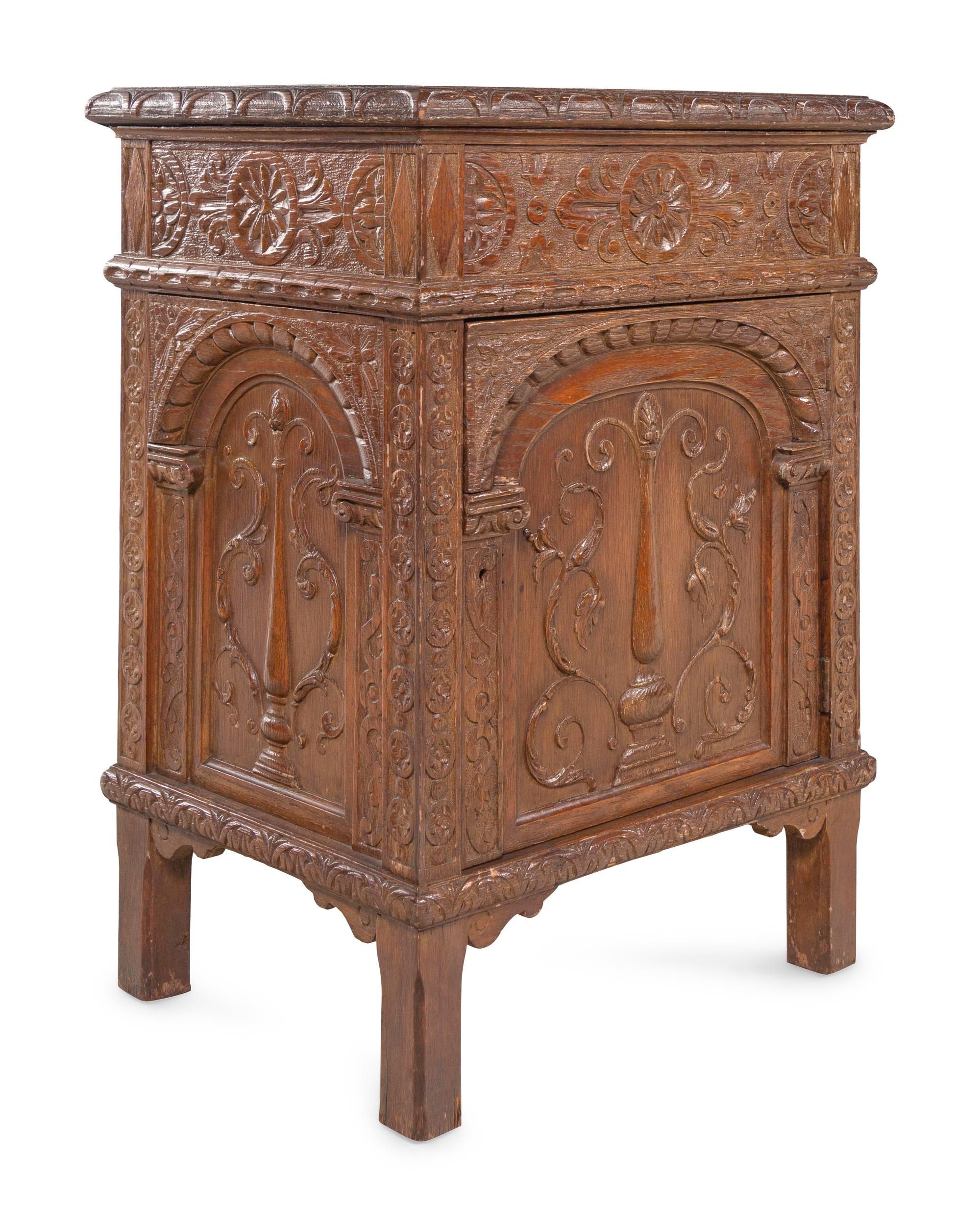 A Near Pair of Renaissance Style Carved Oak Side Cabinets