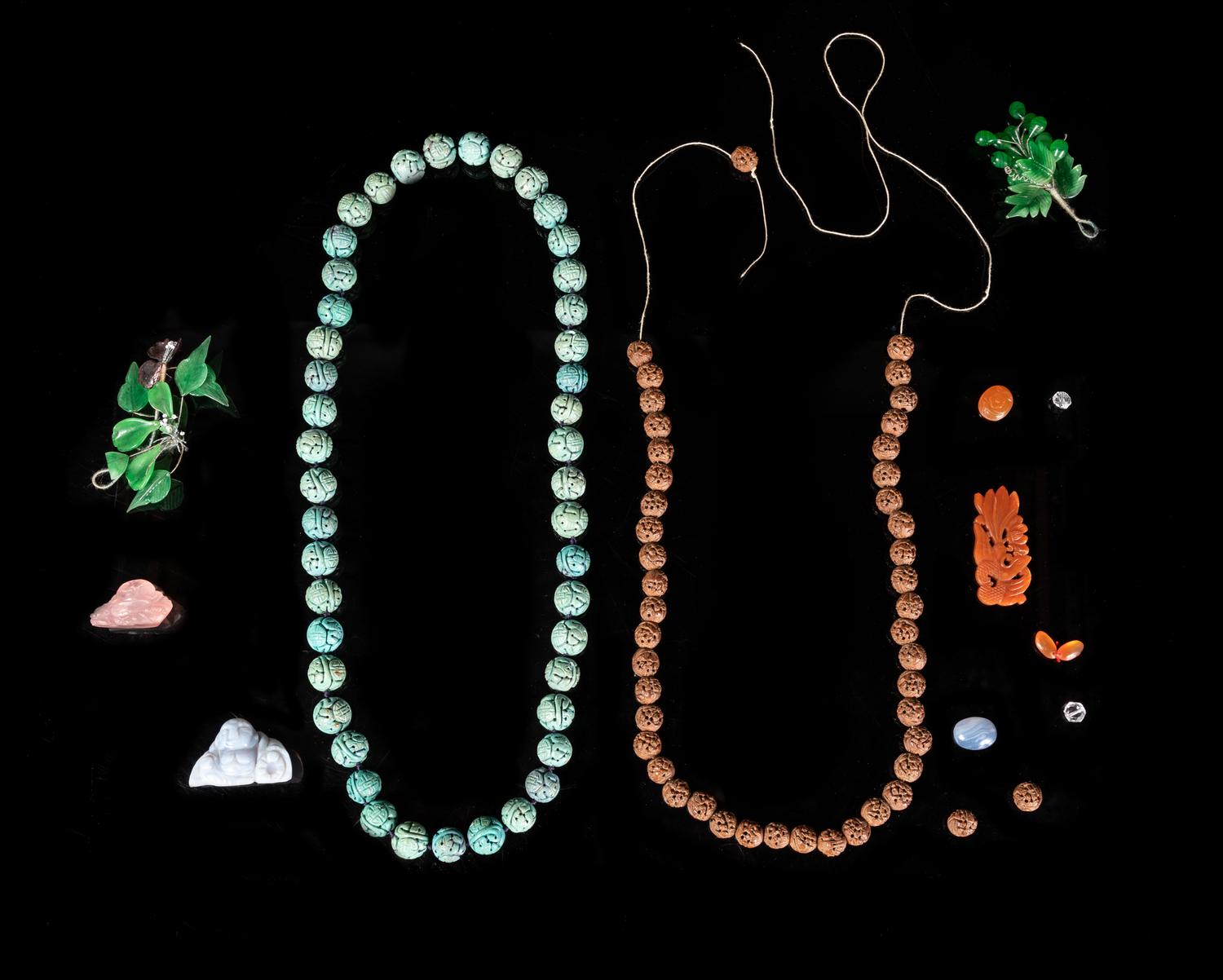 A Large Collection of Chinese Hardstone and Glass Beads and Pendants