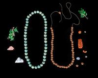 A Large Collection of Chinese Hardstone and Glass Beads and Pendants