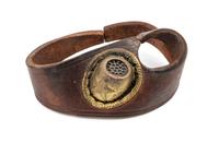 A Leather and Gilt Metal Sailmaker Palm Thimble, , the thimble having a gilt metal finish, attached to a leather hand strap.