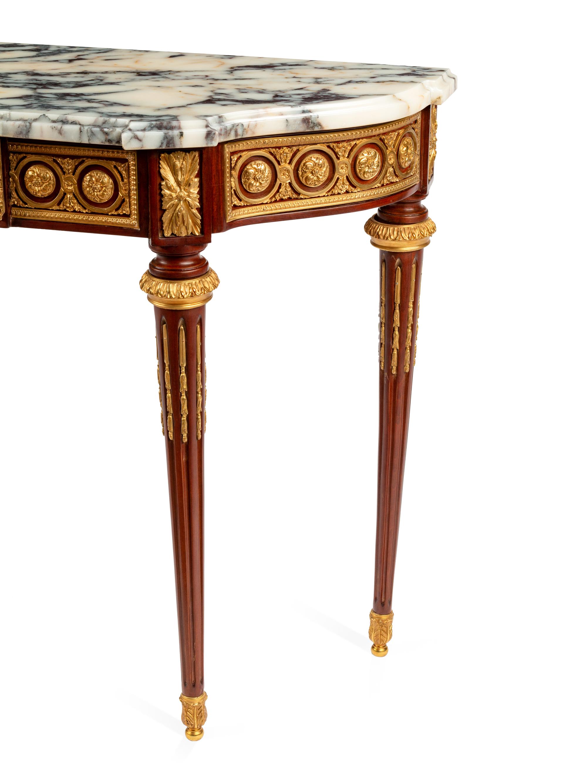 A Louis XVI Style Gilt Bronze Mounted Mahogany Marble-Top Console Table
