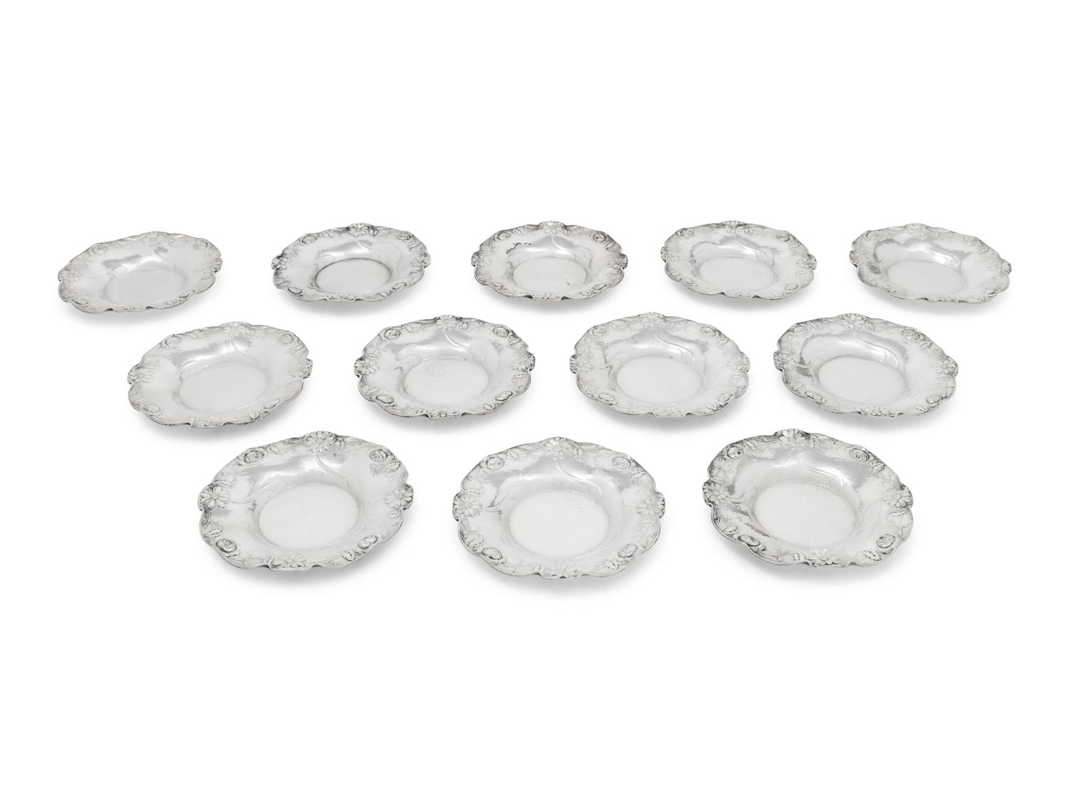 A Set of Twelve American Silver Martelé Coffee Cups and Saucers