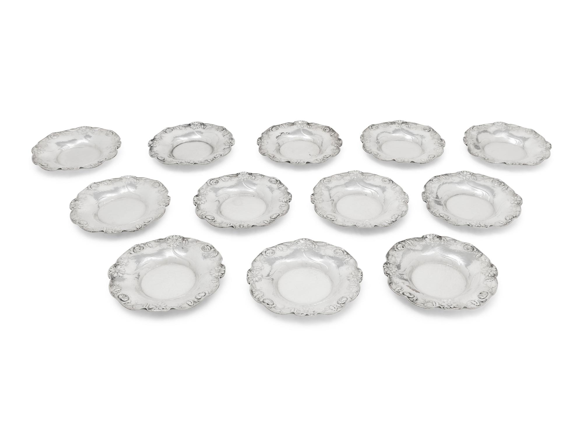 A Set of Twelve American Silver Martelé Coffee Cups and Saucers