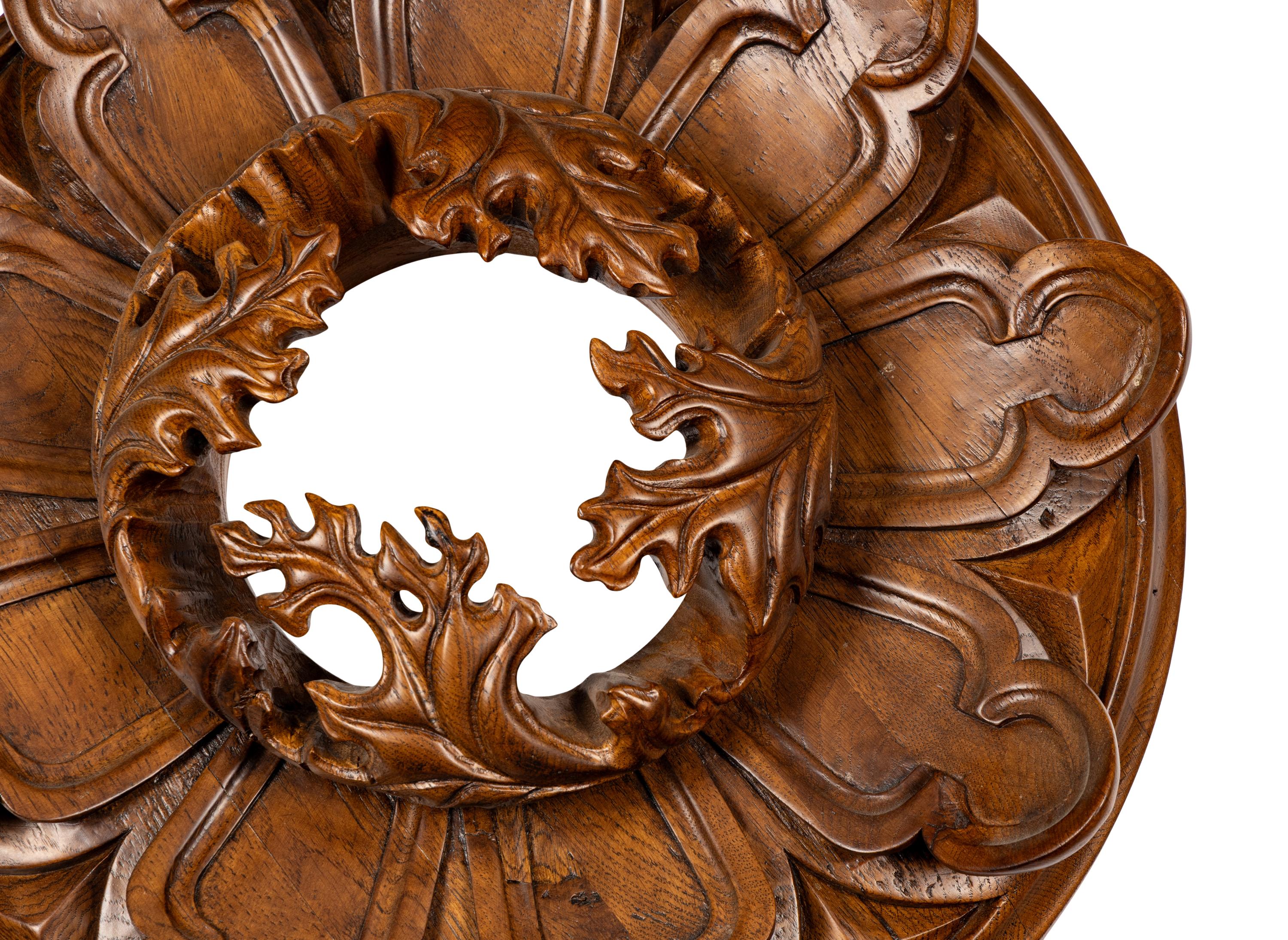 A Pair of Carved Oak Roundels