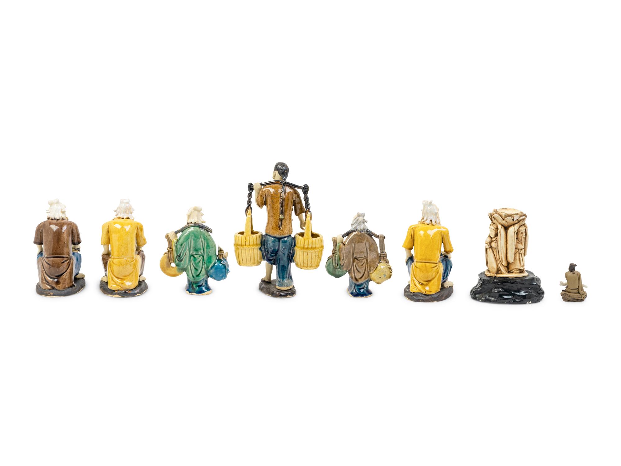 Eight Chinese Polychrome Enameled Pottery Figures