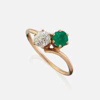 A diamond, emerald, and gold ring