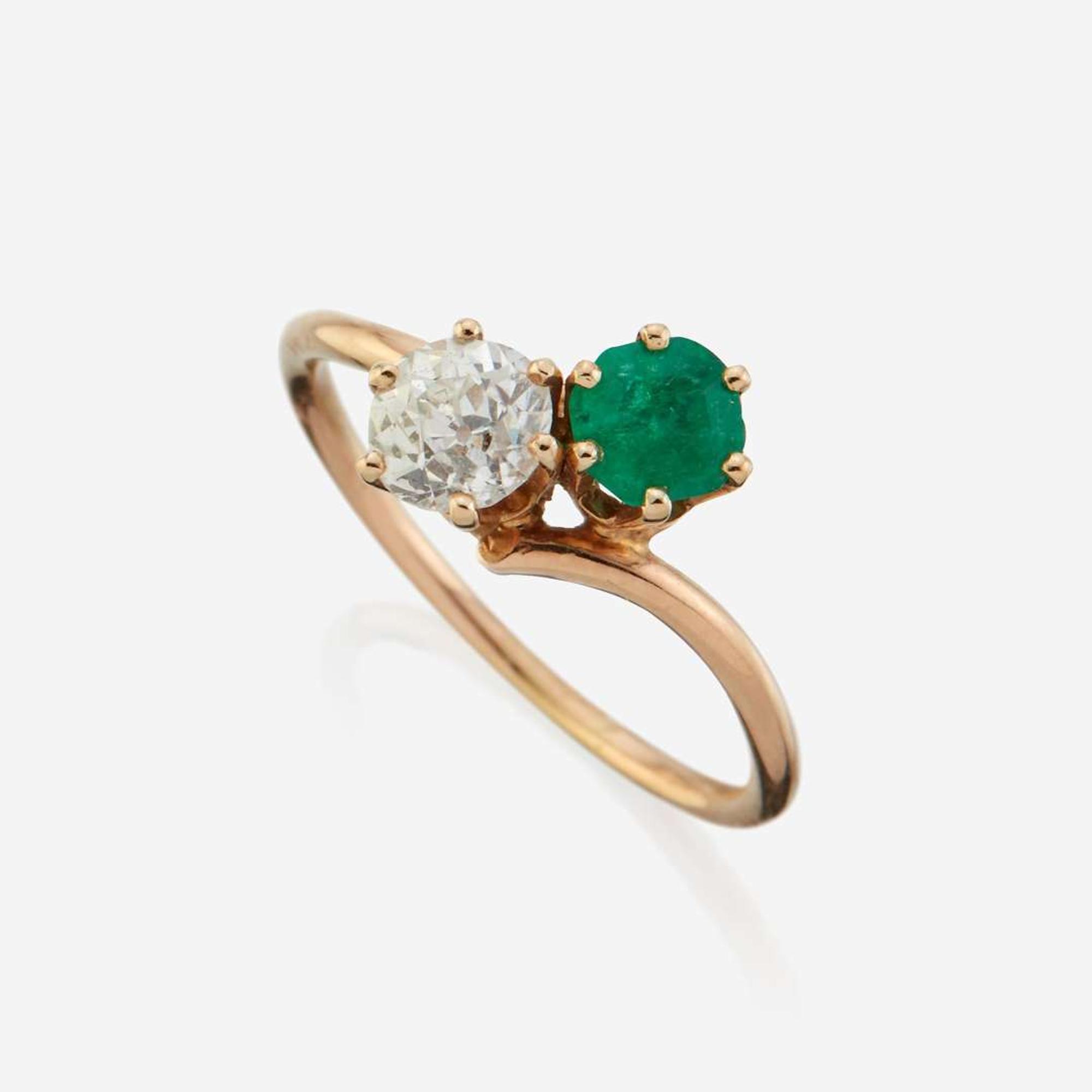 A diamond, emerald, and gold ring