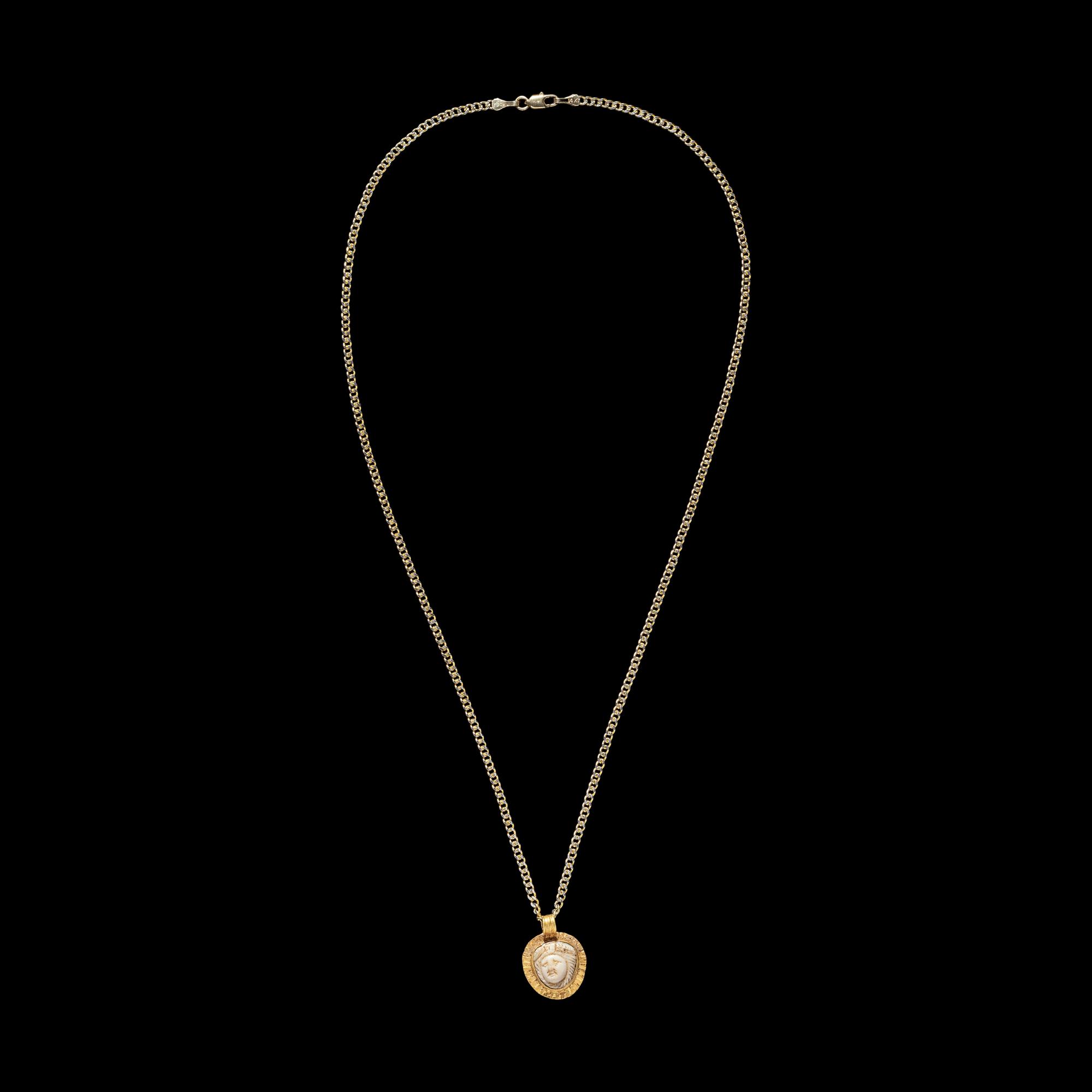 A Roman Gold and Onyx Cameo Pendant with Medusa — with a modern gold chain