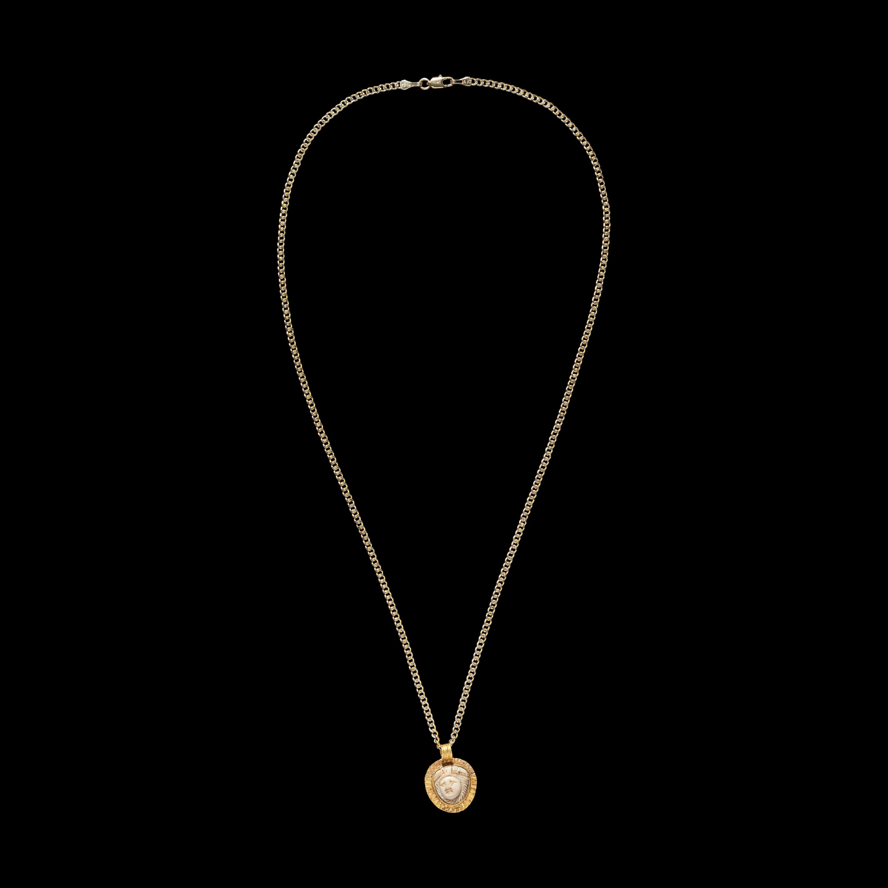A Roman Gold and Onyx Cameo Pendant with Medusa — with a modern gold chain
