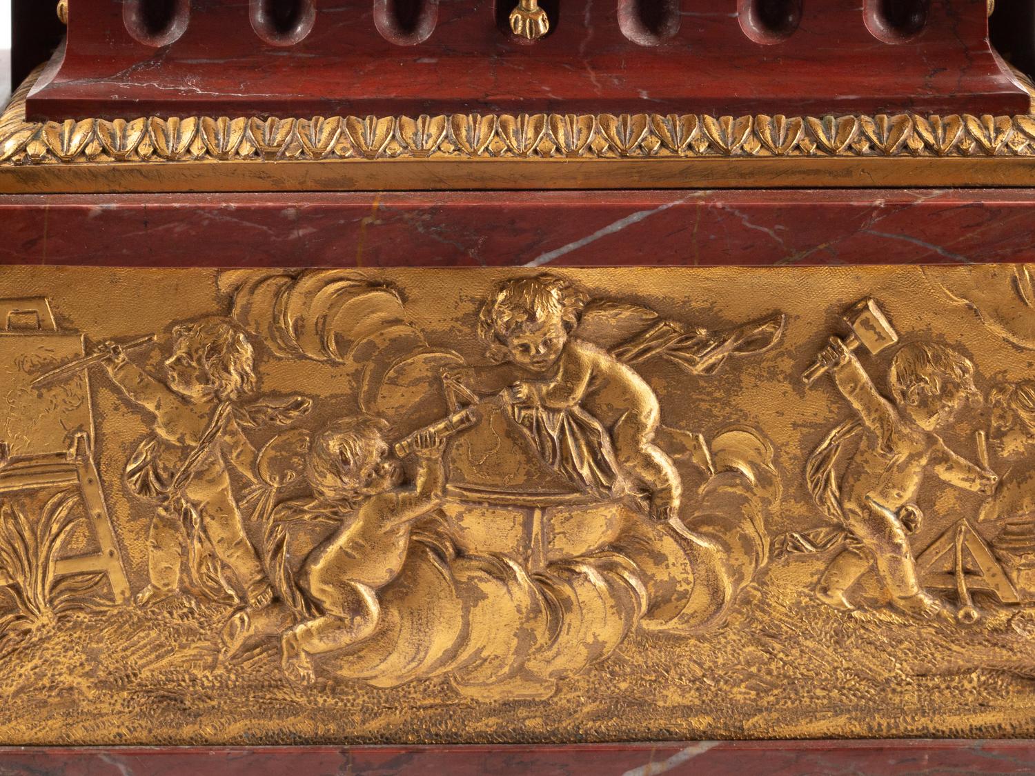 A Louis XVI Style Gilt Bronze and Rouge Griotte Marble Mantel Clock