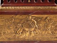 A Louis XVI Style Gilt Bronze and Rouge Griotte Marble Mantel Clock