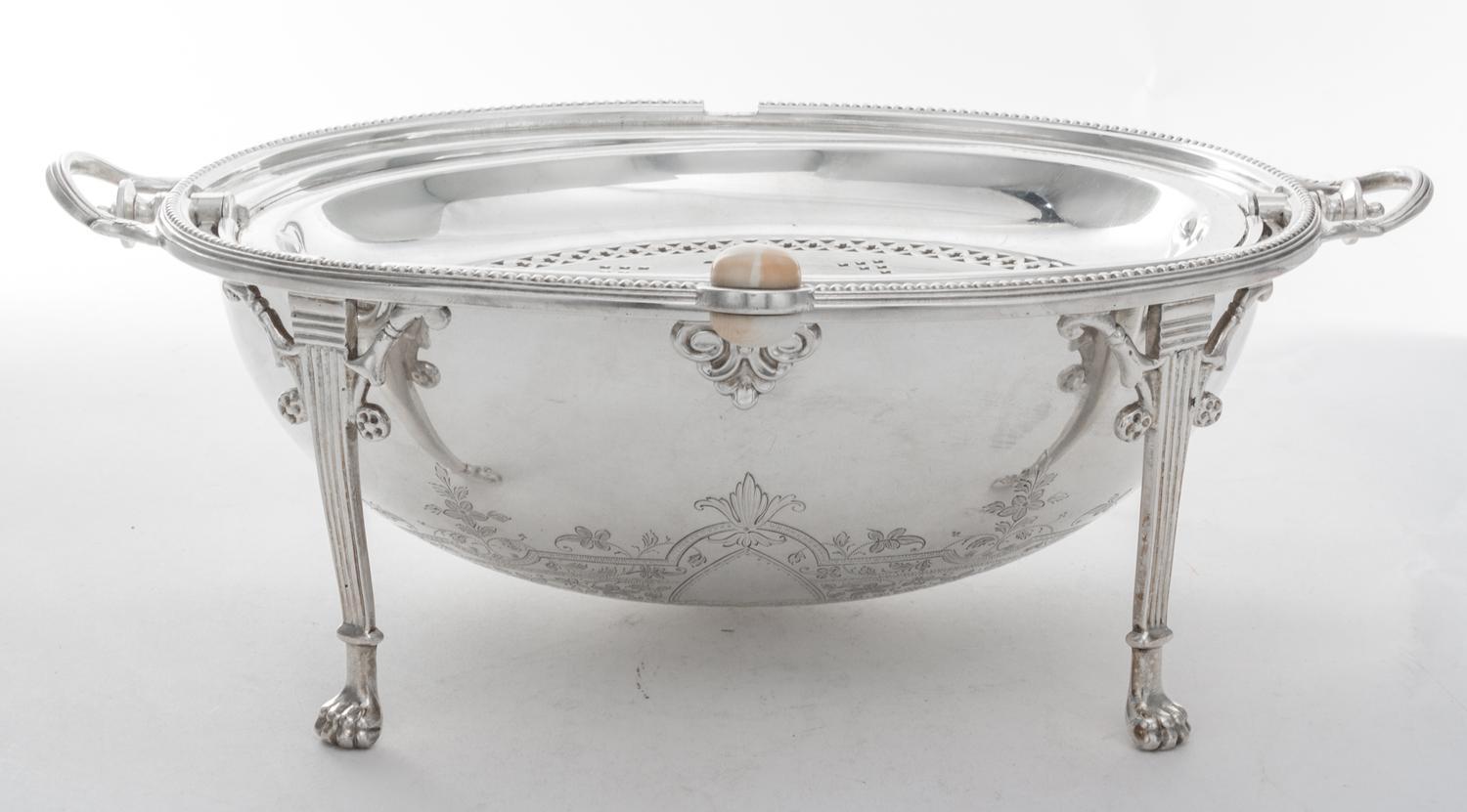A Silver-plate Bacon Warmer, , of ovoid form with a rotating lid and raised on four monoped feet.