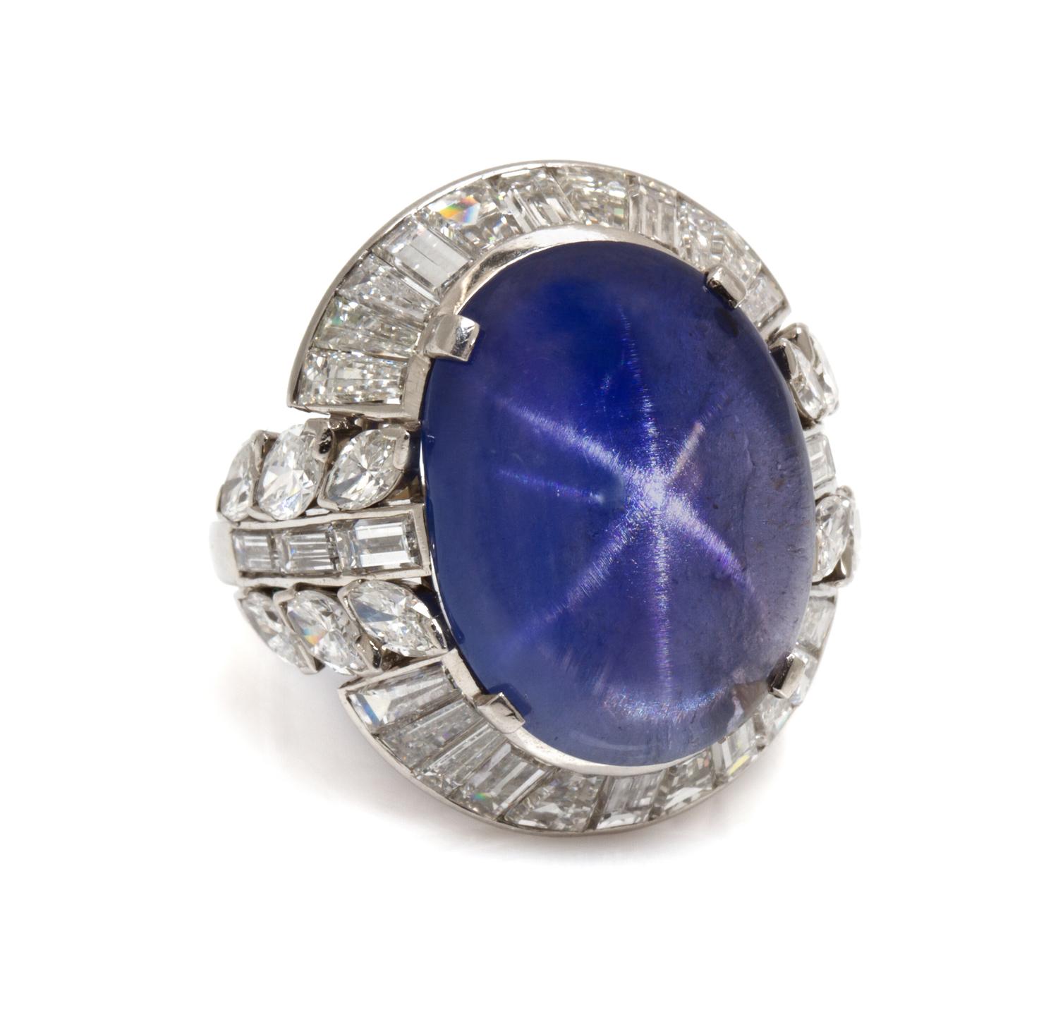 A Platinum, Burmese Star Sapphire and Diamond Ring, 12.70 dwts.
