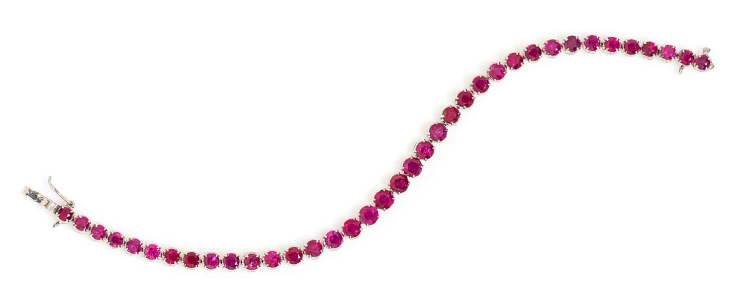 An 18 Karat White Gold and Ruby Line Bracelet, 7.40 dwts.