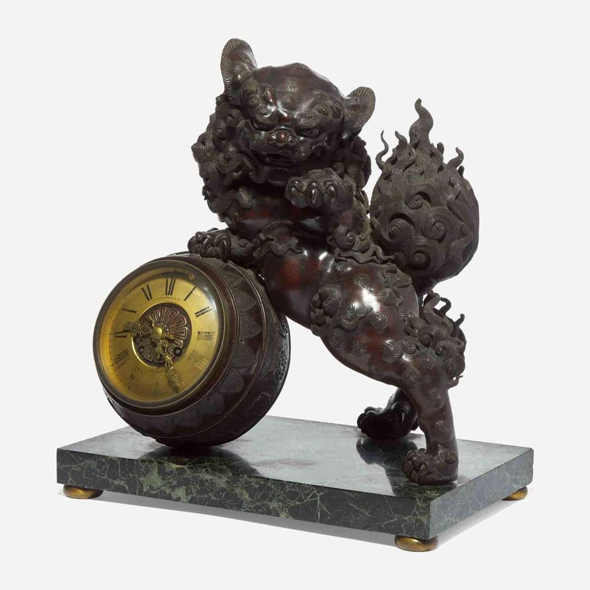 A Japanesque patinated bronze and verde marble mantel clock J.E. Caldwell & Co., Philadelphia, PA, late 19th / early 20th century