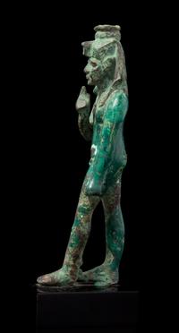 An Egyptian Bronze Striding Harpokrates Height 5 3/4 inches. — LATE PERIOD, DYNASTY 26-30, 664-343 B.C.E.