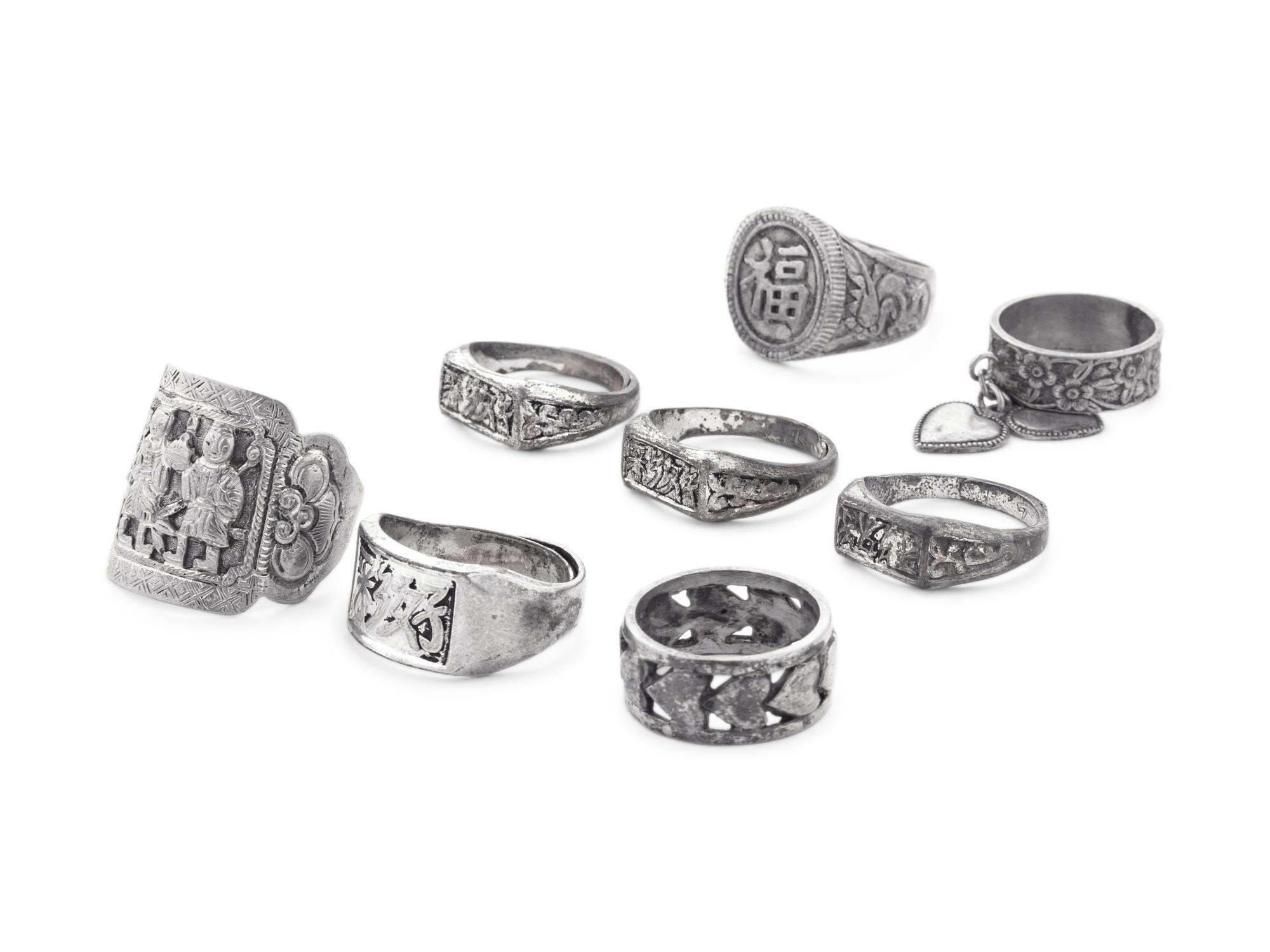 Eight Chinese Silver and Metal Rings