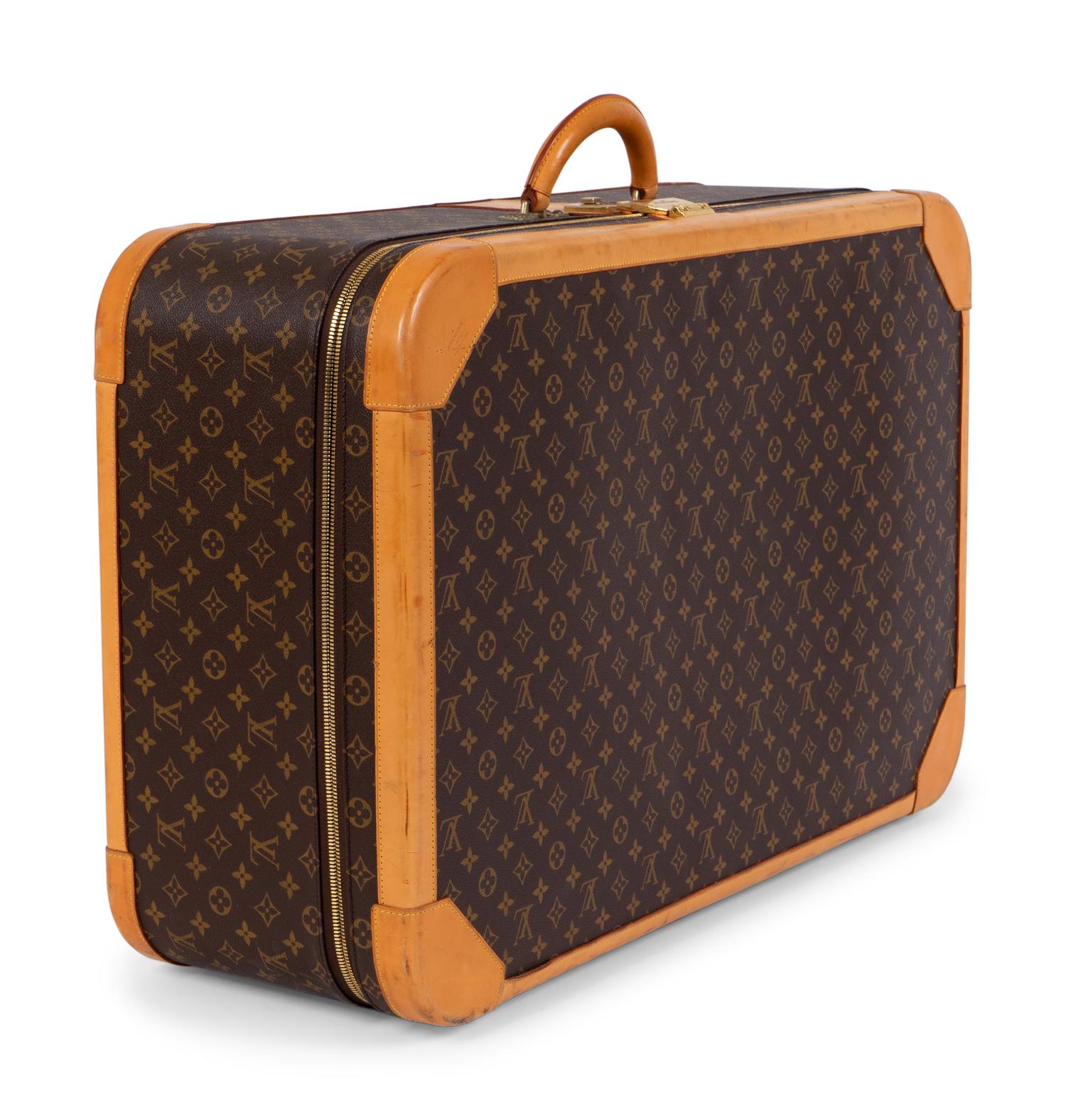 A Louis Vuitton Hard Sided Suitcase — 20TH CENTURY