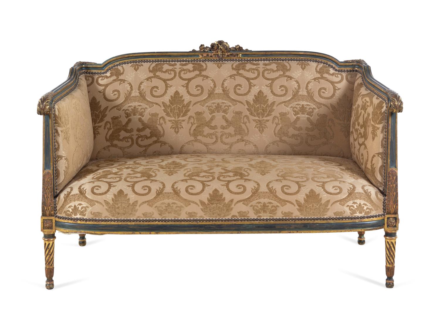 A Louis XV/XVI Transitional Style Painted and Parcel Gilt Settee