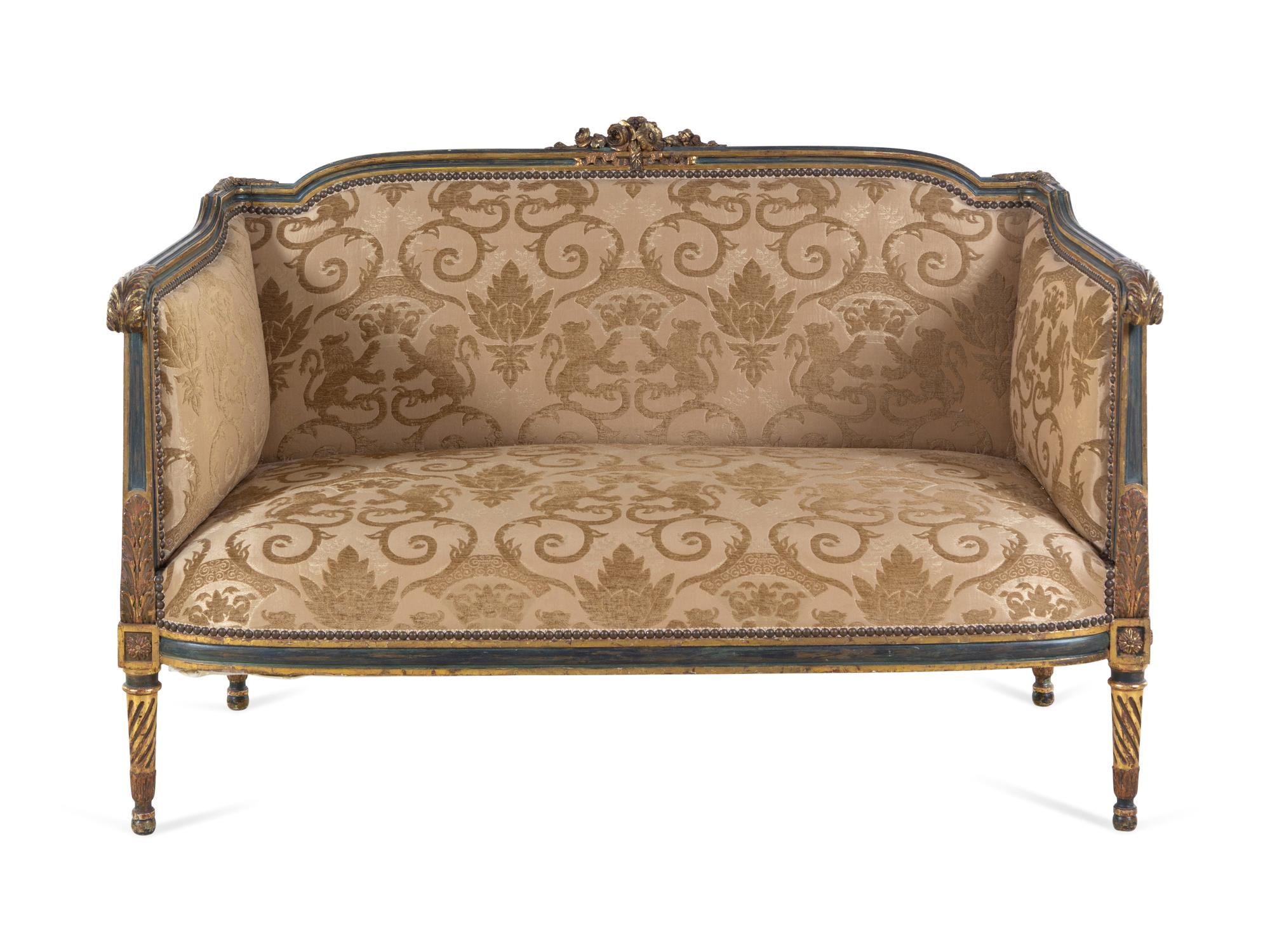 A Louis XV/XVI Transitional Style Painted and Parcel Gilt Settee
