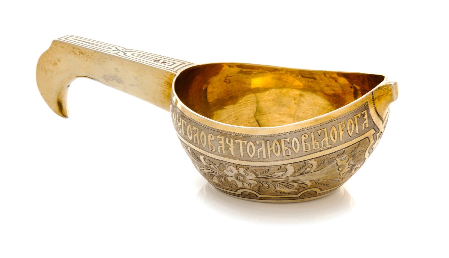 A Russian Silver-Gilt Kovsh, Mark of Andrei Vekman, assay mark of V. Savinsky, Moscow, 1875, the body decorated with a Cyrillic inscrip