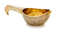 A Russian Silver-Gilt Kovsh, Mark of Andrei Vekman, assay mark of V. Savinsky, Moscow, 1875, the body decorated with a Cyrillic inscrip