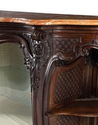 A Rococo Revival Carved Walnut Marble-Top Vitrine Cabinet