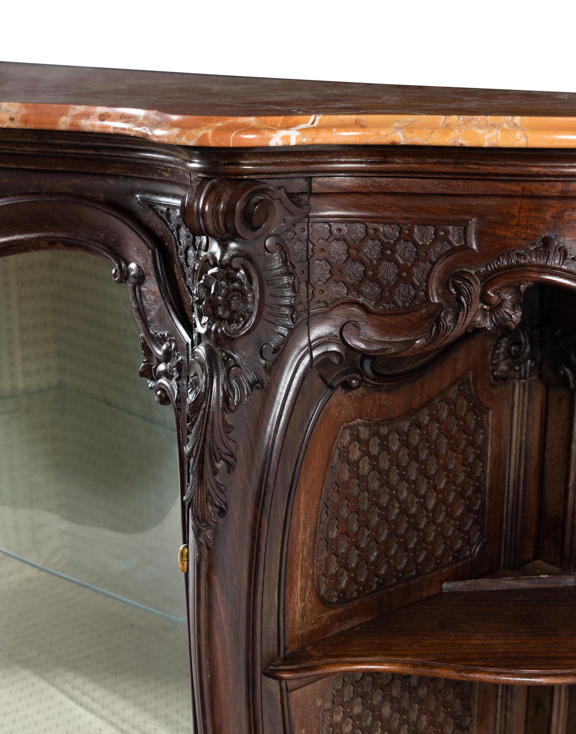 A Rococo Revival Carved Walnut Marble-Top Vitrine Cabinet