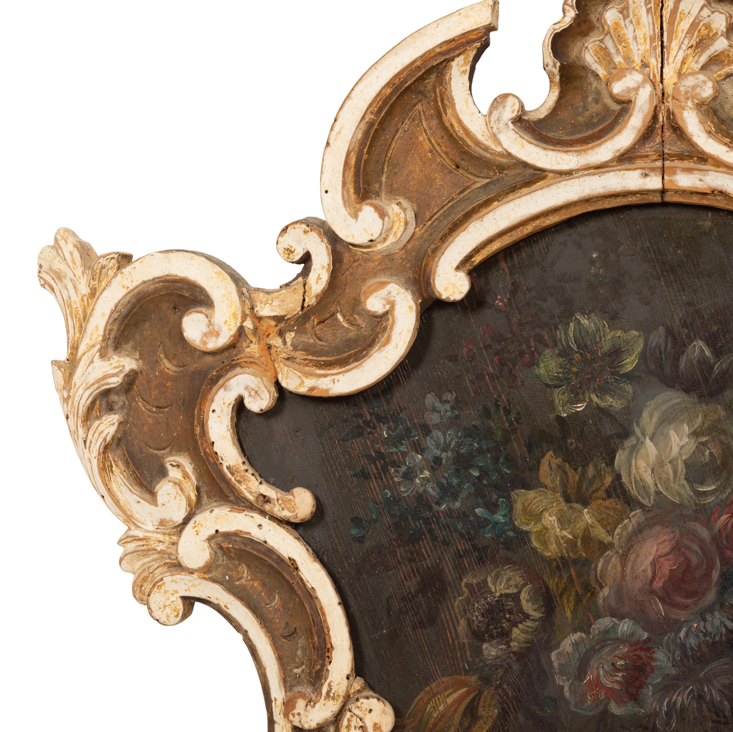 An Italian Floral Painted Panel in a Painted and Parcel Gilt Rococo Frame