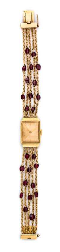 An 18 Karat Yellow Gold and Garnet Multi Strand Wristwatch, French, 14.70 dwts.