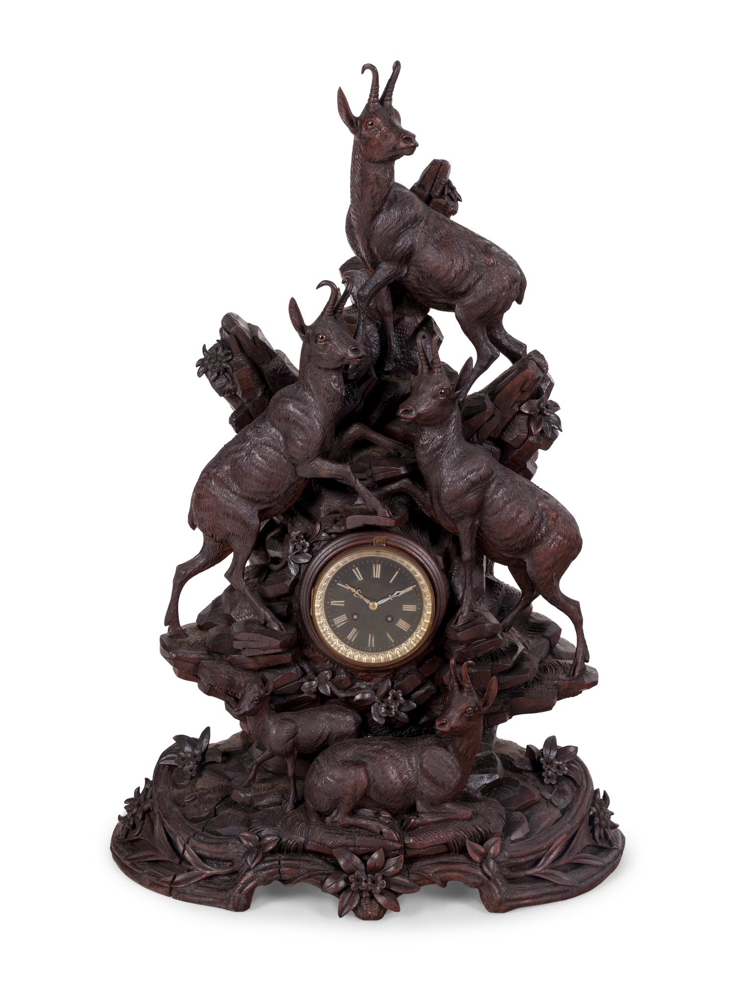 A Black Forest Carved Mantel Clock