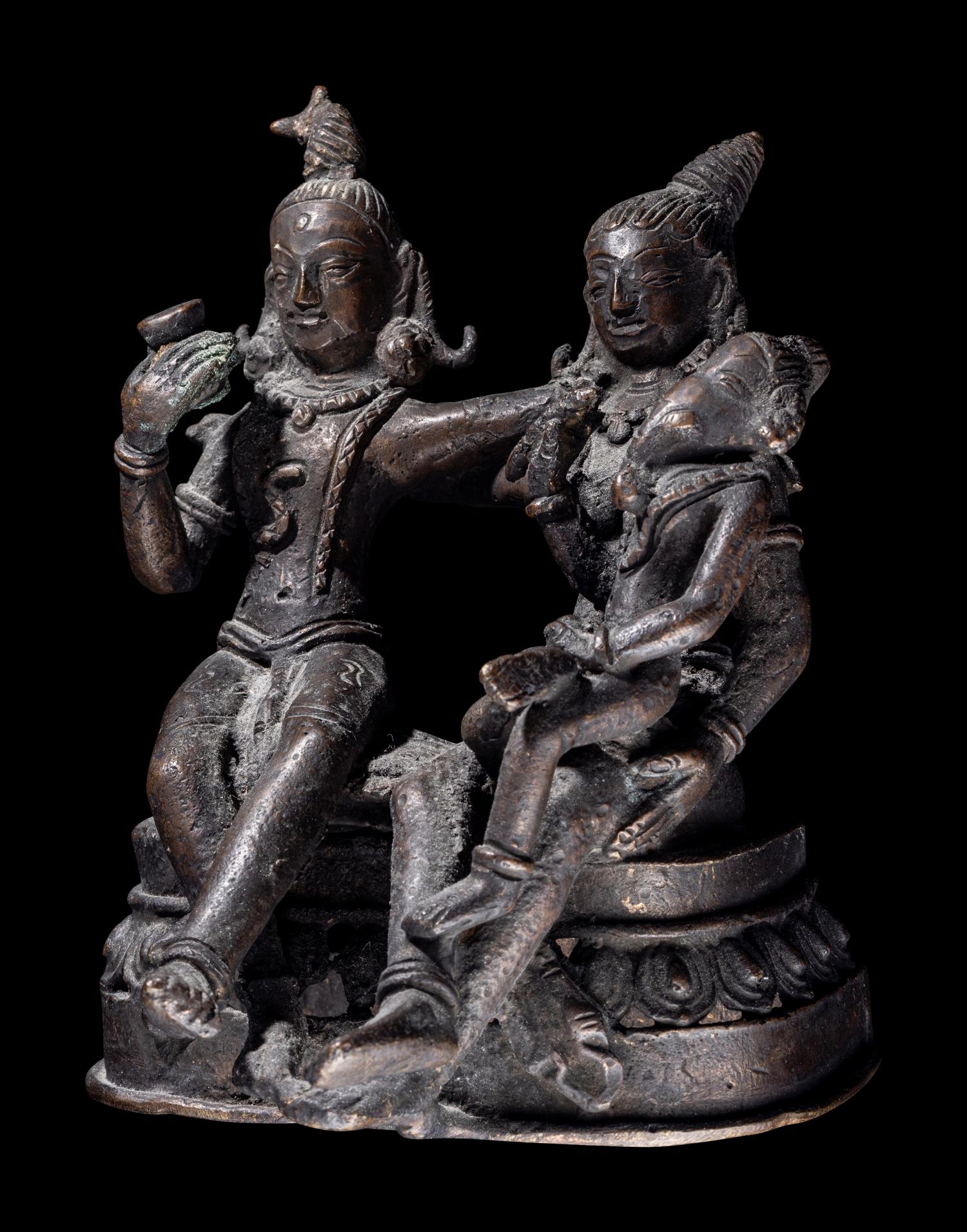 An Indian Bronze Group of Shiva and Parvati with Ganesha