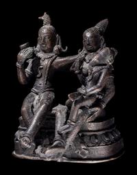 An Indian Bronze Group of Shiva and Parvati with Ganesha