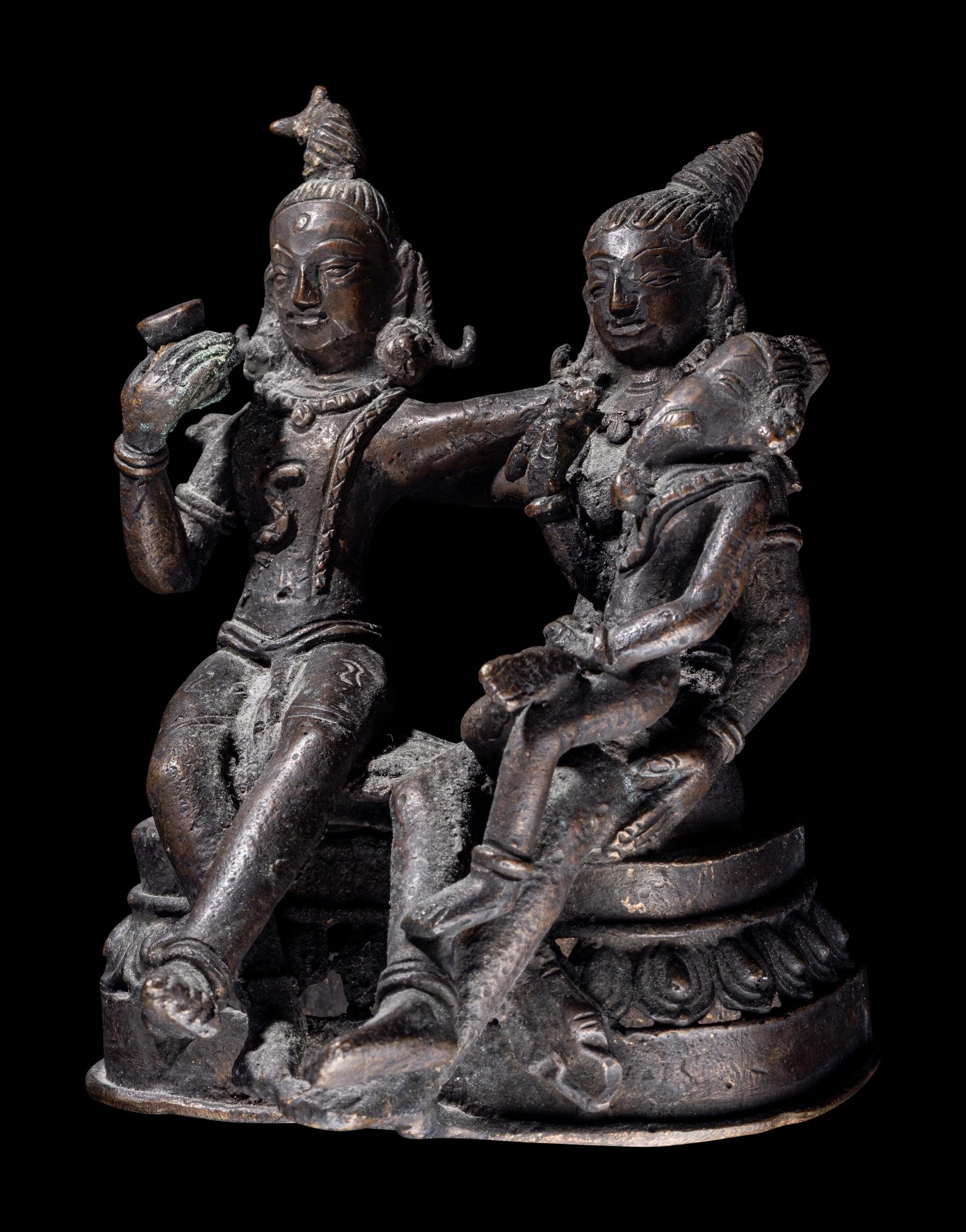 An Indian Bronze Group of Shiva and Parvati with Ganesha