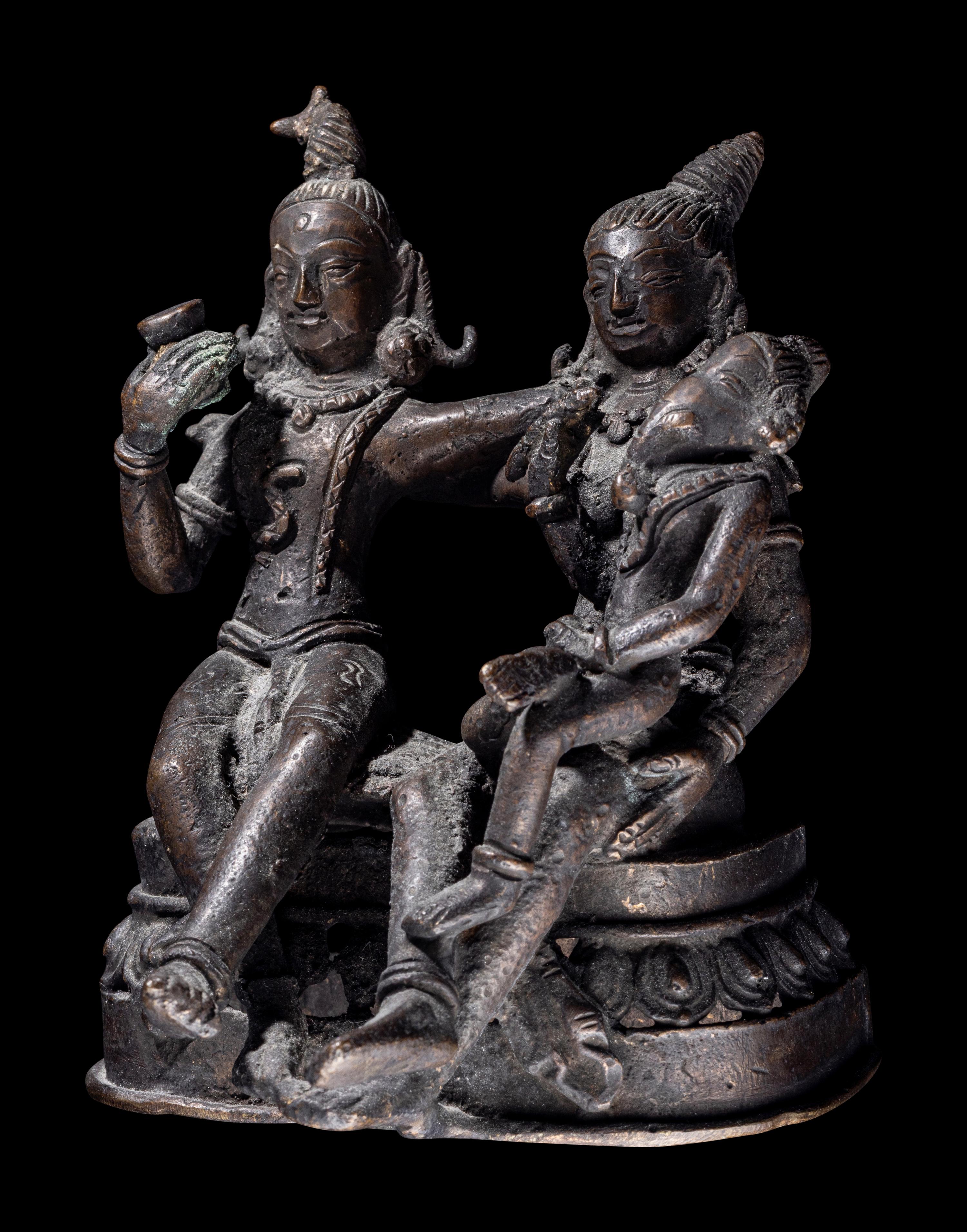 An Indian Bronze Group of Shiva and Parvati with Ganesha