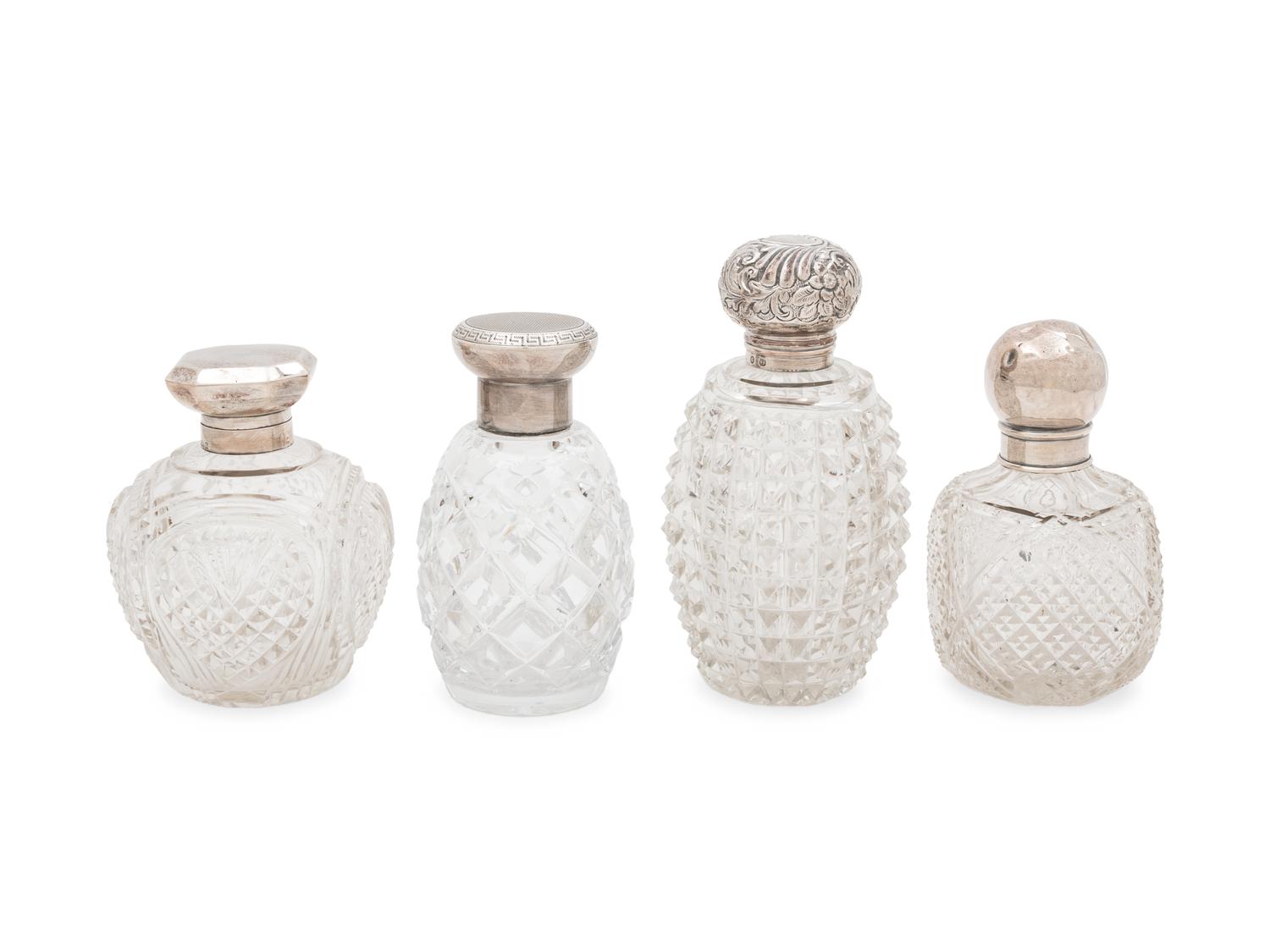 Four English Silver Mounted Cut Glass Bottles