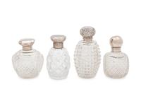 Four English Silver Mounted Cut Glass Bottles