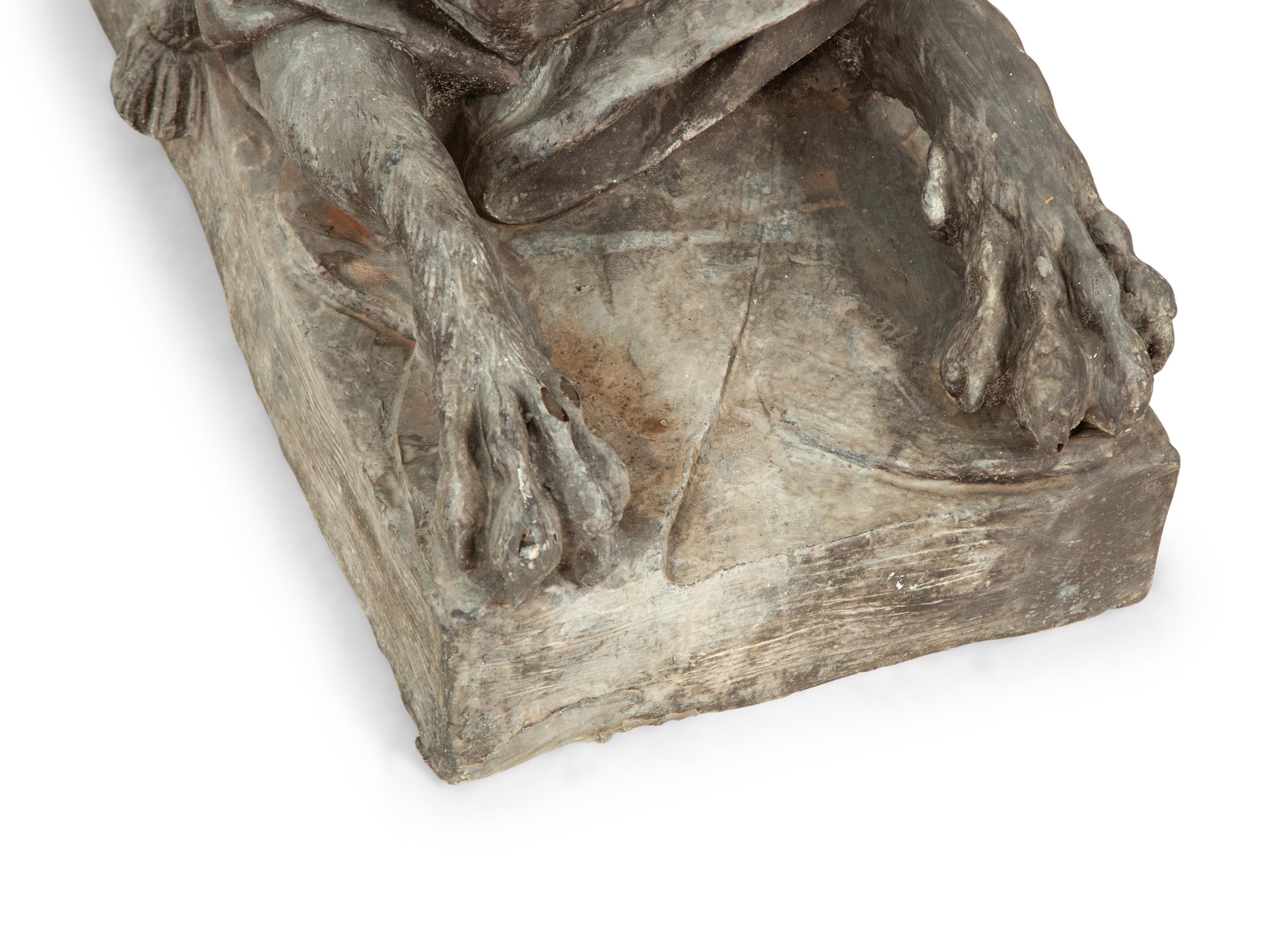 A Pair of Patinated Fiberglass Sphinxes