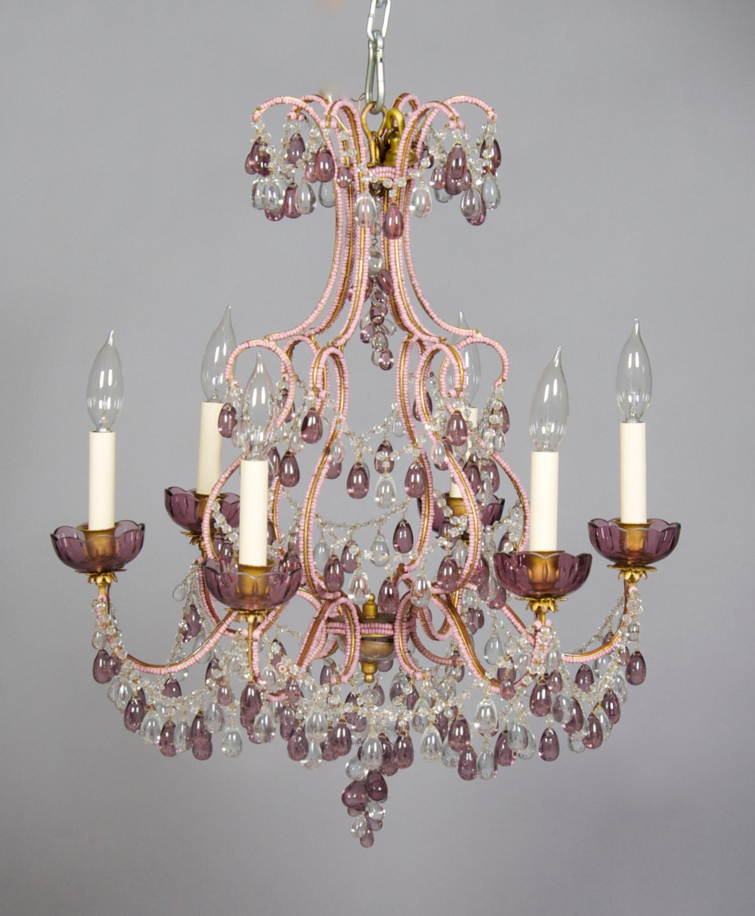 A Crystal Six-Light Chandelier, Height 24 1/2 inches, diameter 20 3/4 inches.