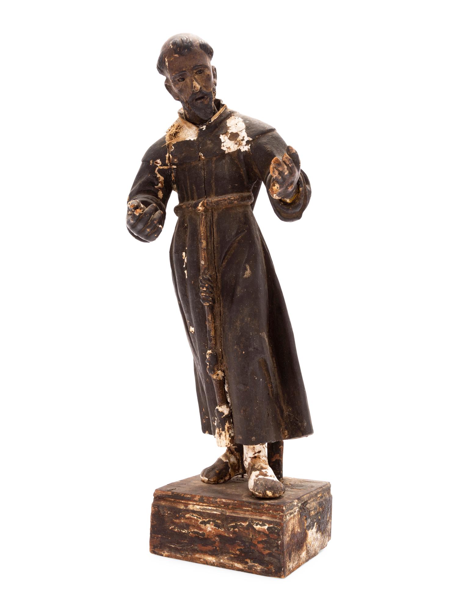 A Spanish Colonial Painted Wood Figure of a Saint
