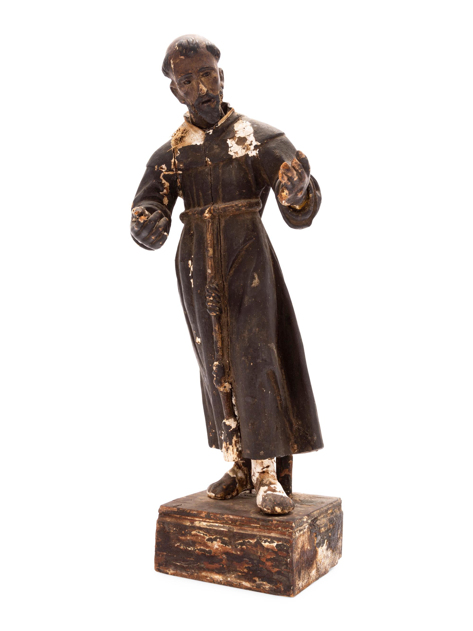 A Spanish Colonial Painted Wood Figure of a Saint