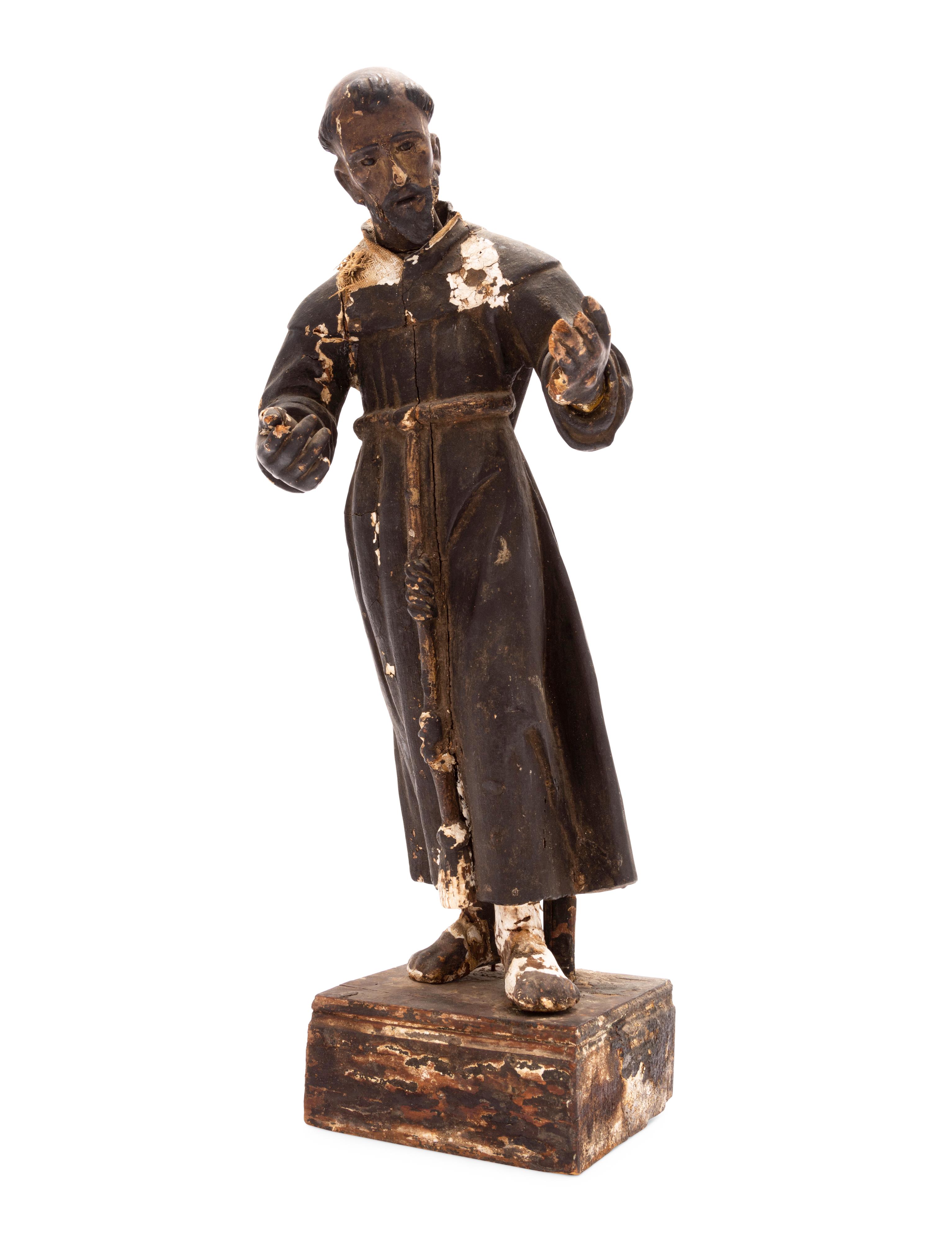 A Spanish Colonial Painted Wood Figure of a Saint