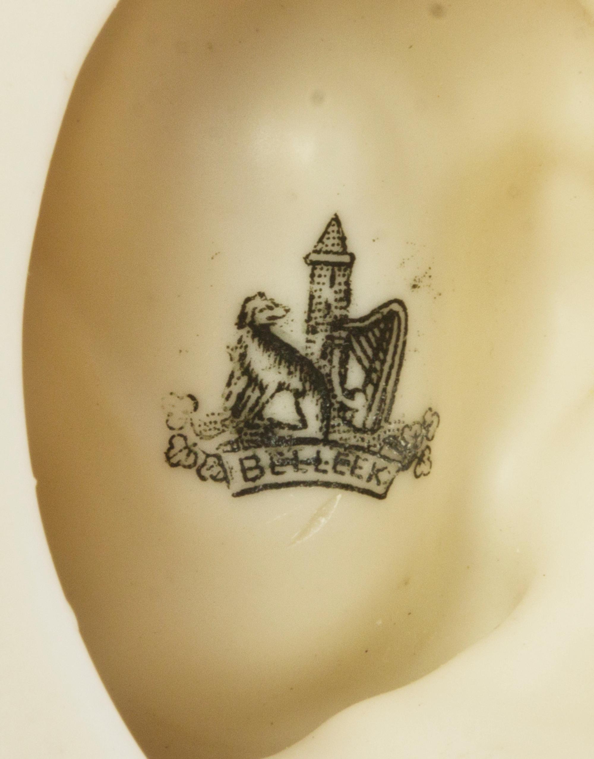A Belleek Fish Spill Vase, Height 7 3/8 inches.