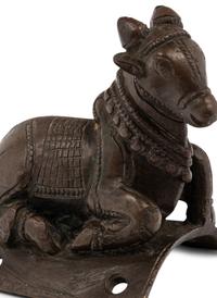 A Small Indian Bronze Figure of a Recumbent Bull