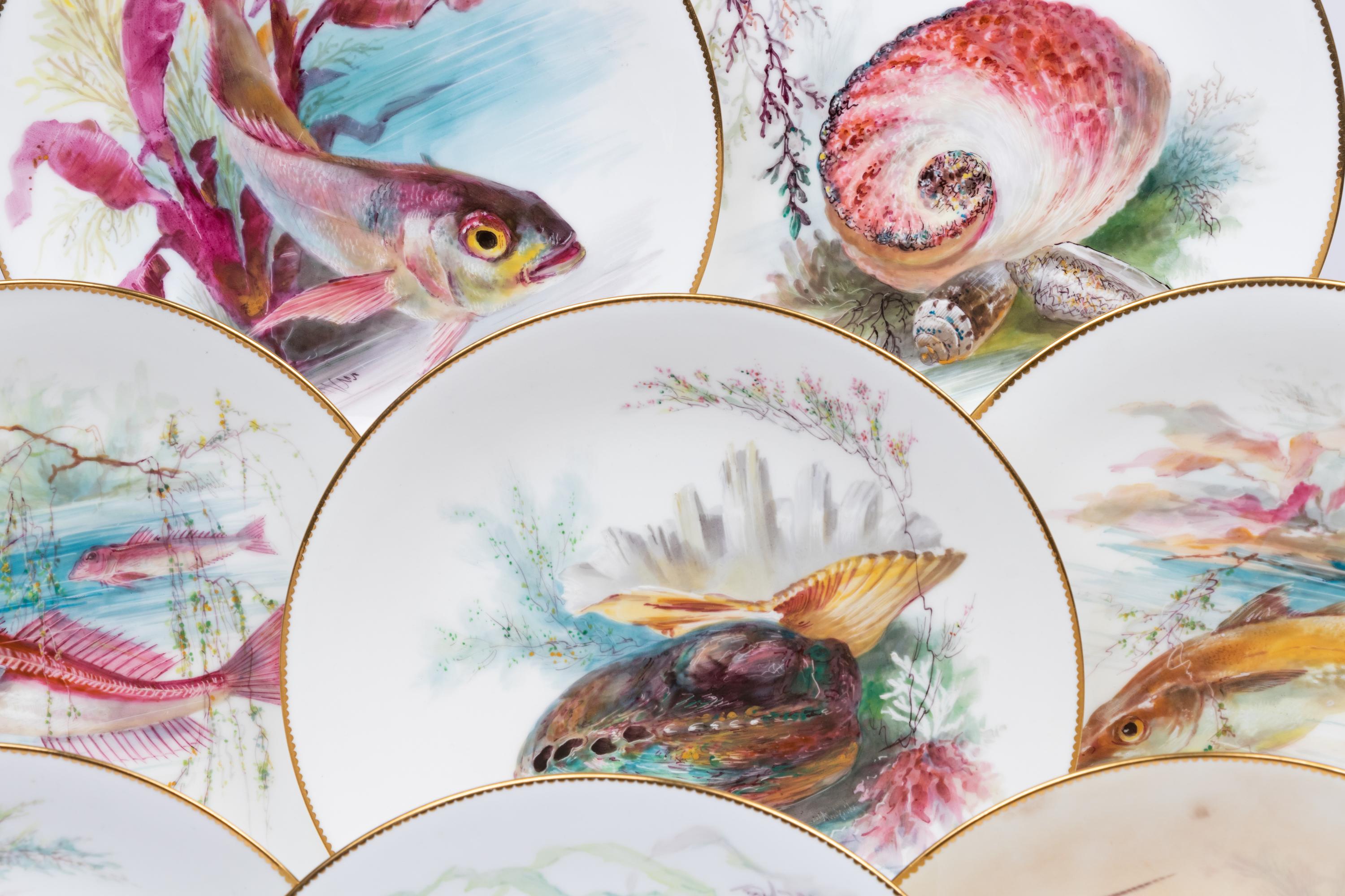 A Set of Twelve Mintons Parcel-Gilt Porcelain Fish and Shell Plates