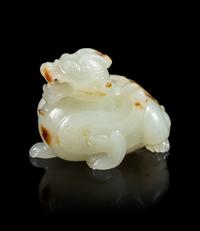 A Celadon and Russet Jade Carving of a Mythical Beast, Bixie Length 1 5/8 inches. — 18TH CENTURY